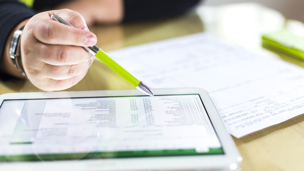Accountant tracking contractor spend with statement of work automation.